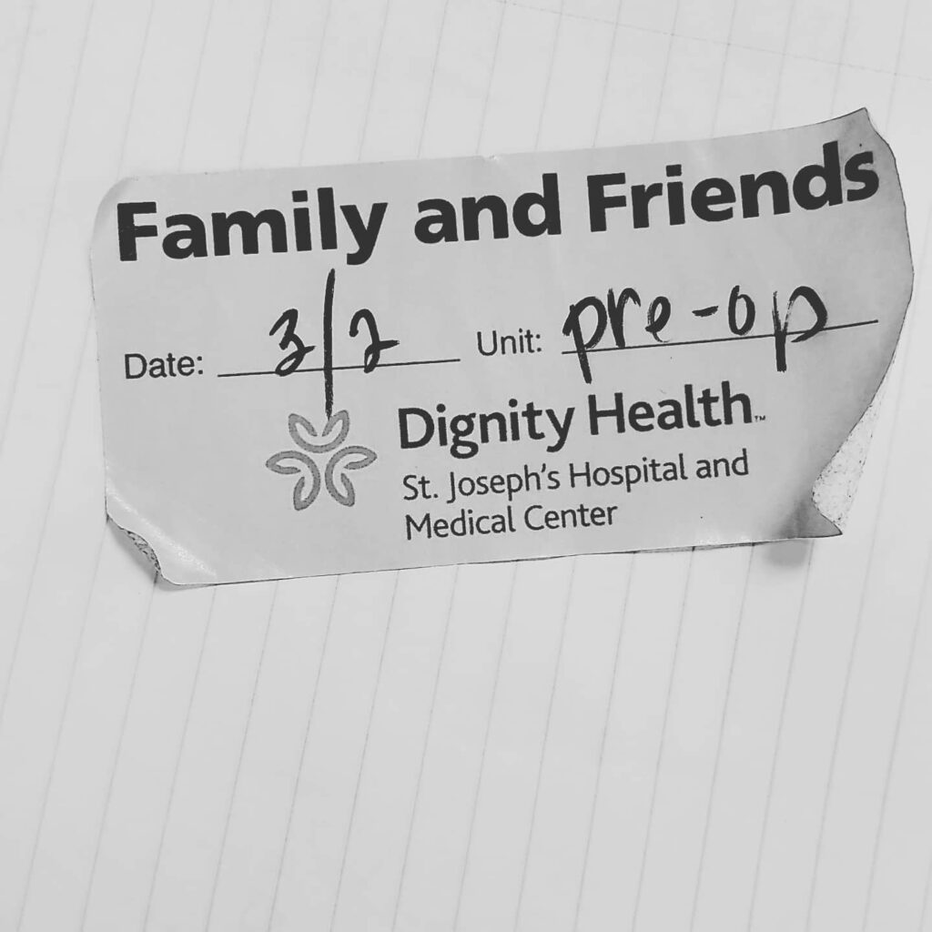 black and white photo of a friends and family pre-op sticker dated 3/2 